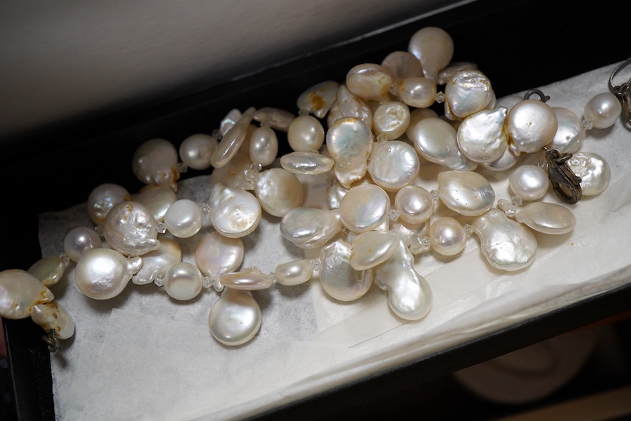 A cultured pearl necklace, composed of graduated cultured pearls of pale pink tint measuring approximately 11-12mm, to a spherical clasp stamped 14K; a black opal measuring approximatley 11 x 7mm, on a display cushion; a